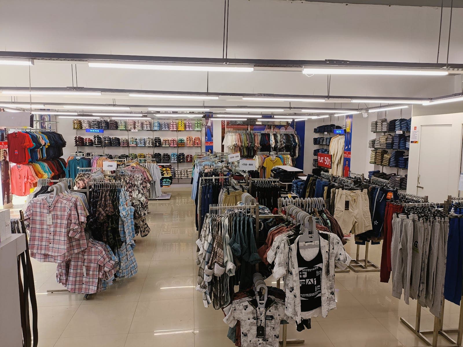 Inside Style Club Katra in Prayagraj — racks of shirts, denim and kidswear